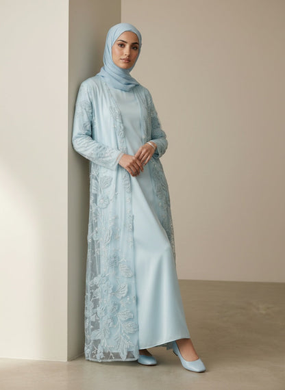 Bloom Collection Floral Abaya Ice Blue - three-quarter back view on model